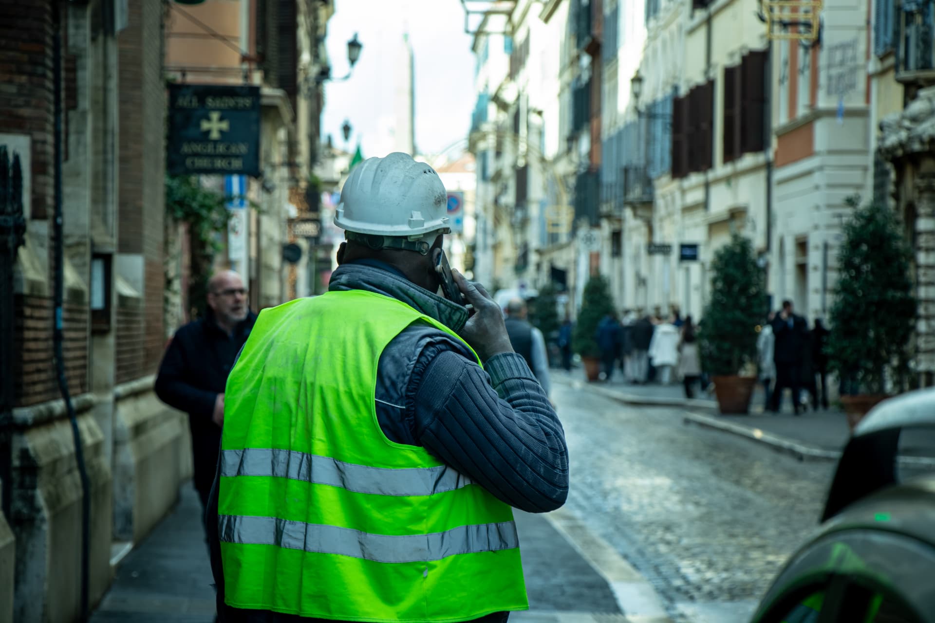 Worker on the phone in a Roman street